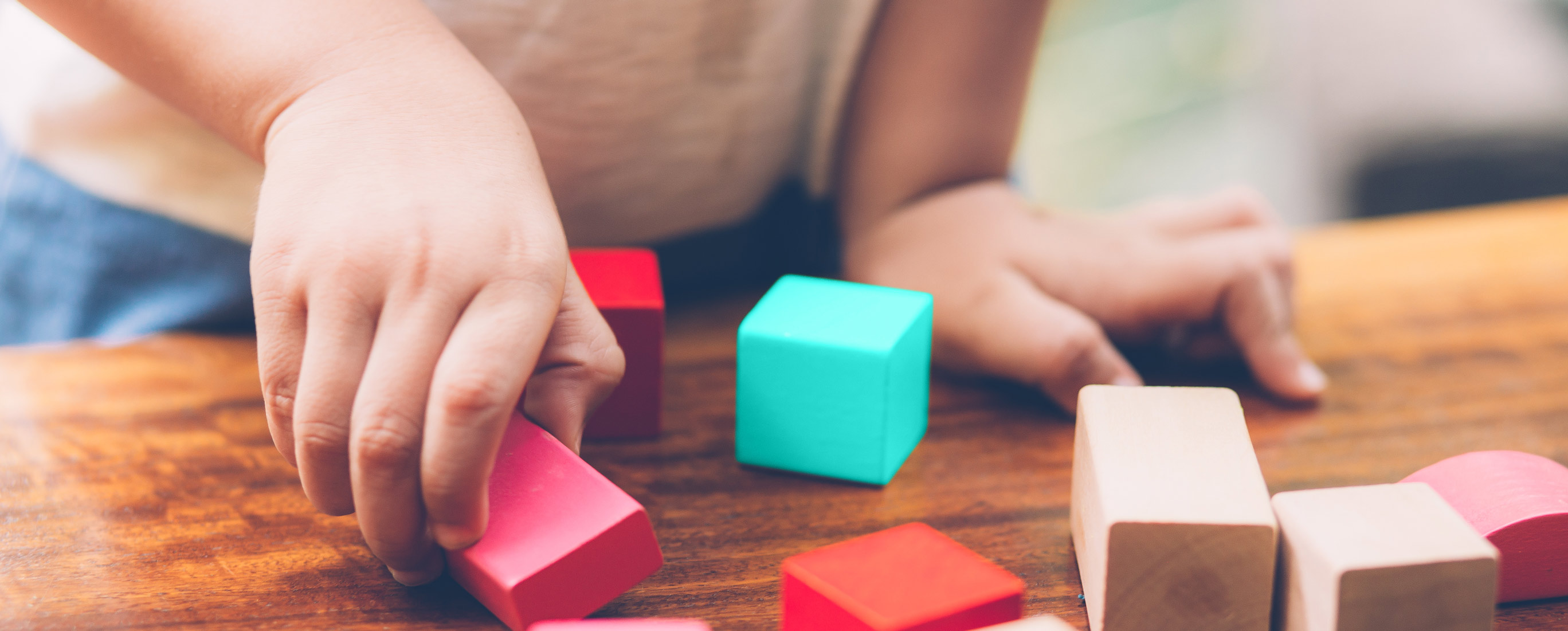 child playing with a cube