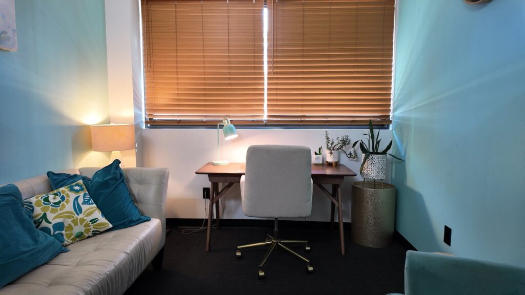 Therapist office with desk and seating in Valley Stream
